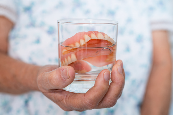 Adjusting To New Dentures: When You Should Replace Your Old Dentures
